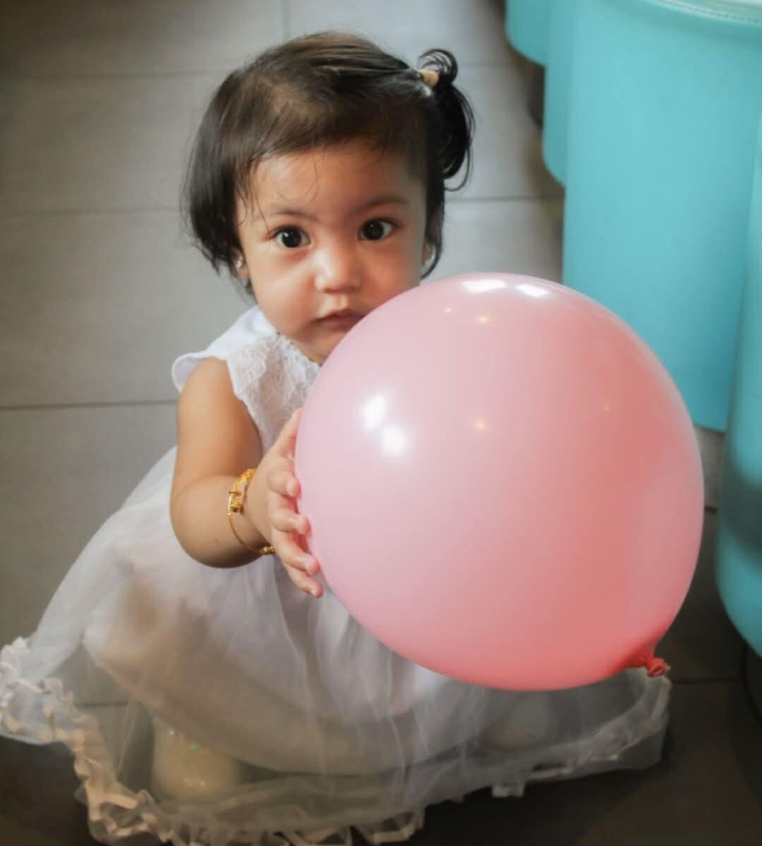 You twirl in bows, you laugh with glee,